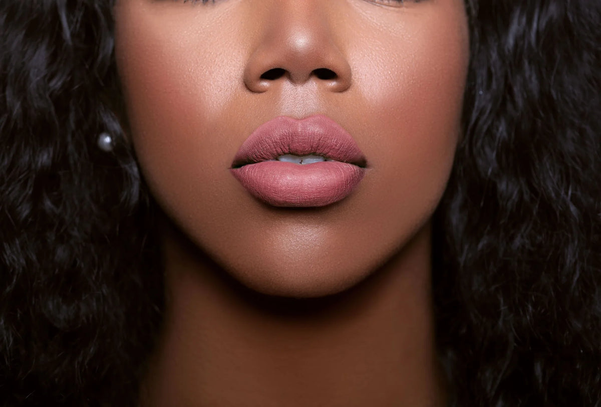 The Glamatory Nud  Lip Potion Lip Gloss on a model