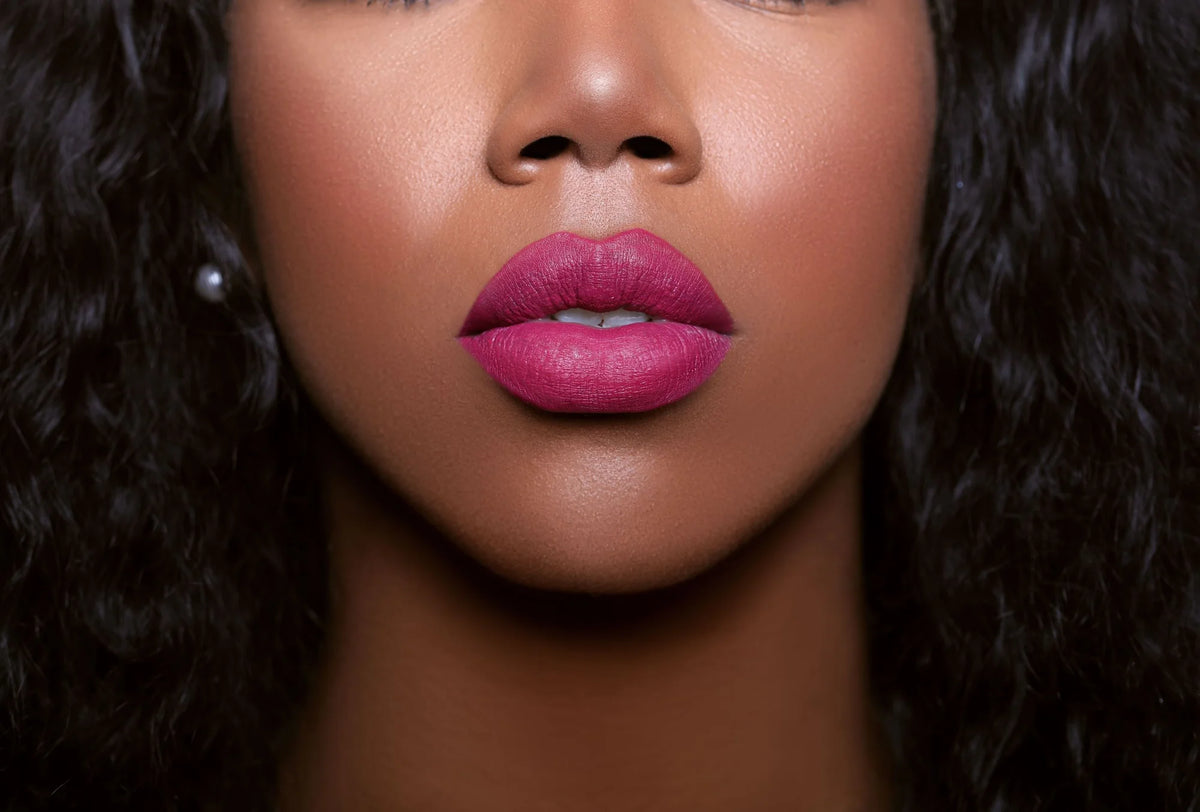 The Glamatory Sugarberry Lip Potion Lip Gloss on a model